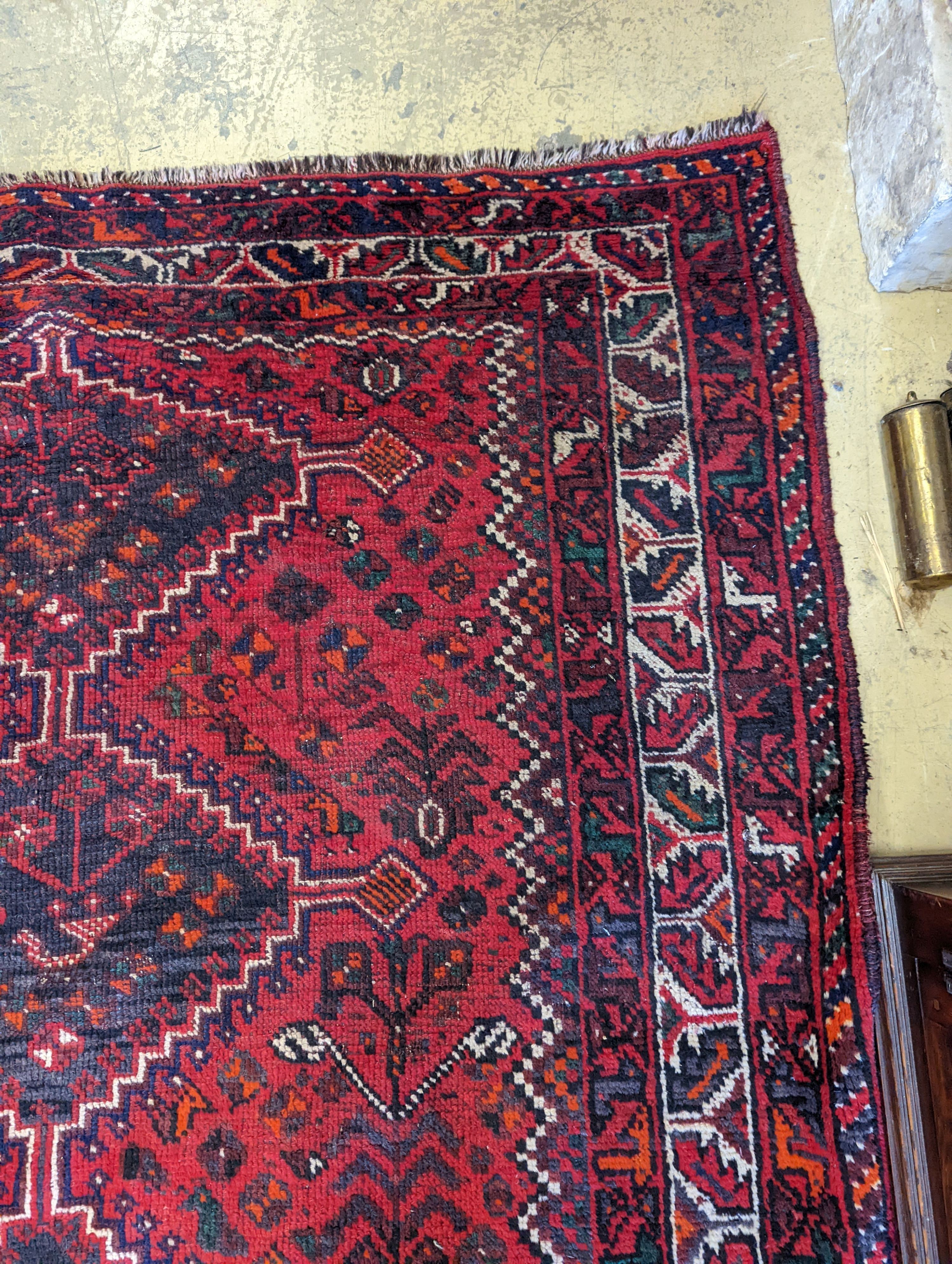 A Caucasian design red ground rug, 200 x 160cm